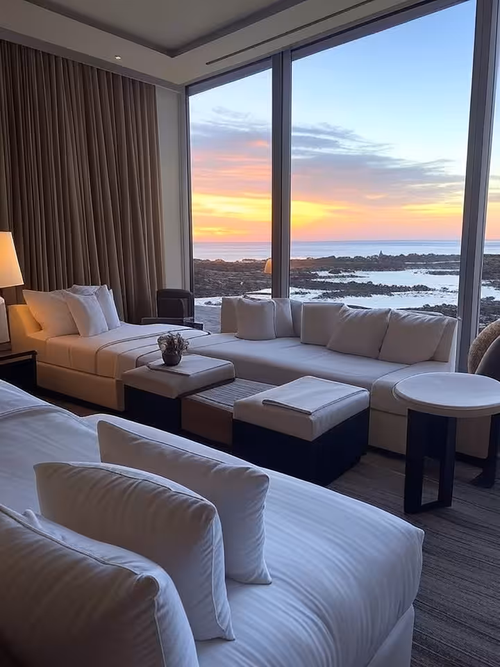 Elegant boutique hotel room with ocean view in Galapagos, modern luxury interior design, floor-to-ce