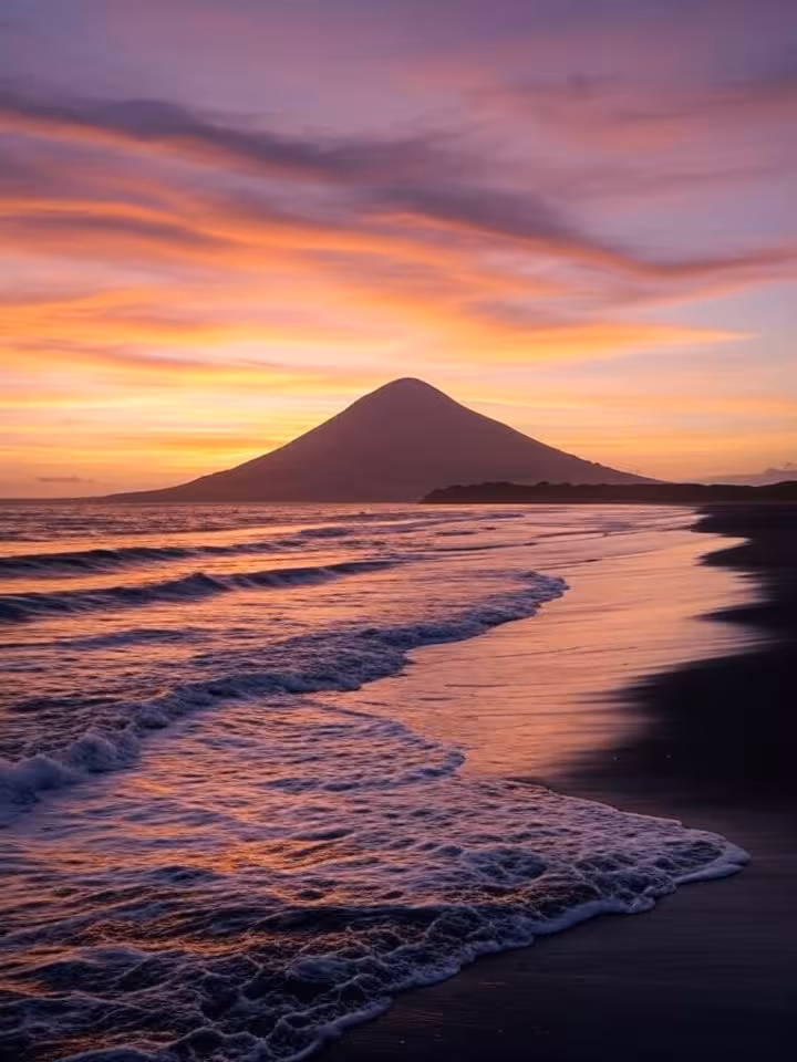 Concepcion volcano cone silhouette against sunset sky in Ometepe Nicaragua, dramatic volcanic landsc