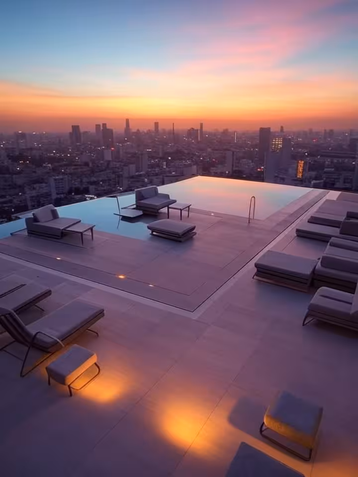 Rooftop terrace of boutique hotel overlooking Latin American city skyline at sunset, infinity pool,