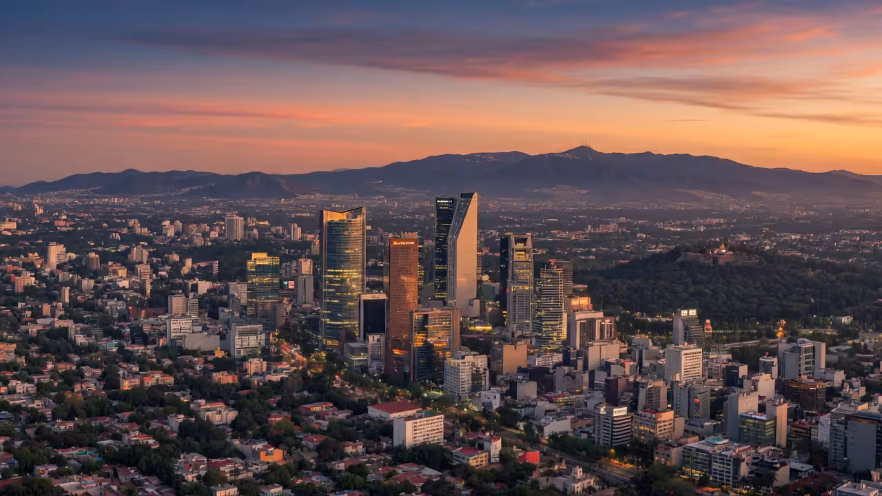 Aerial panoramic view of Mexico City skyline at dusk, modern skyscrapers in Polanco and Santa Fe dis