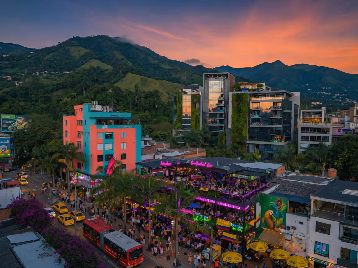 Vibrant Medellin El Poblado district view, lush green mountains surrounding modern buildings, tropic